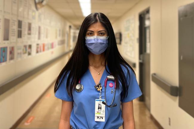 Hadia Bilal Ahmad, a nurse, stands in a hallway at Michael Garron Hospital