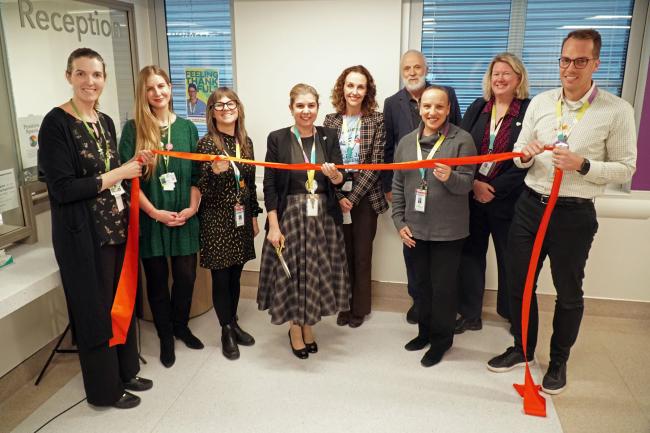Extensive Needs Service opening MGH President and CEO Melanie Kohn cuts the ribbon for the Extensive Needs Service’s new dedicated clinical space with the MGH Mental Health and Substance Use Team and guests.
