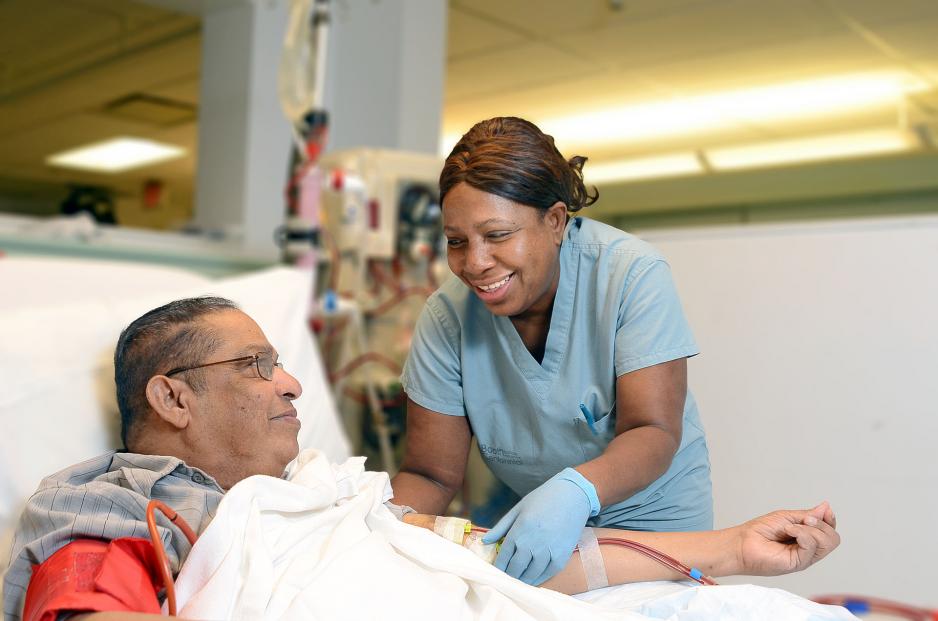 Dialysis Healthcare professional tending to patient