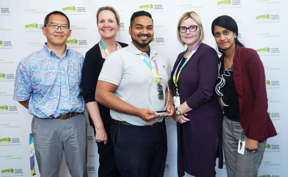 The MGH Infection Control Team accepted the Be Excellent award for their research on implementing human factor design. (Left to right: Wayne Lee, Anna O'Shaughnessy, Benson Joseph, Angela Portsmouth, and Sajeetha Sasikanthan) (Photo by: Ellen Samek)