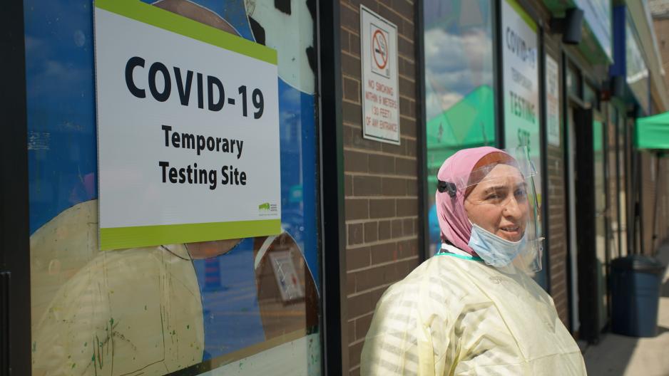 Community ambassador Shaklo Sharipova stands outside the pop-up COVID-19 testing site in Thorncliffe Park.